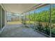 Enclosed sunroom featuring screens for ventilation and views of the backyard at 1760 Sharondale Dr, Clearwater, FL 33755