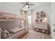 Delightful bedroom featuring a playful bunk bed, cheerful decor, and ample natural light at 20659 Drake Elm Dr, Land O Lakes, FL 34638