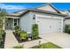 Charming single-Gathering home with a two-car garage, manicured landscaping, and inviting curb appeal at 20659 Drake Elm Dr, Land O Lakes, FL 34638
