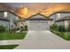Beautiful single-Gathering home with a two-car garage, well-kept lawn, and attractive landscaping at 20659 Drake Elm Dr, Land O Lakes, FL 34638