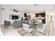 Bright and open living area with modern furnishings, a dining area, and sleek decor at 20659 Drake Elm Dr, Land O Lakes, FL 34638