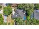 Overhead view of the property showcasing the backyard pool and the home's layout at 213 Sheffield E Cir, Palm Harbor, FL 34683