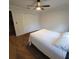Bright bedroom featuring a ceiling fan, and plush carpet flooring at 213 Sheffield E Cir, Palm Harbor, FL 34683