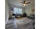 Bright bedroom with a ceiling fan, large closet and a window at 213 Sheffield E Cir, Palm Harbor, FL 34683