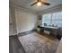 This room has a ceiling fan, large closet, and a large window at 213 Sheffield E Cir, Palm Harbor, FL 34683