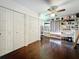 Large custom closet complete with wood floors, built in shelving, and ample storage space at 213 Sheffield E Cir, Palm Harbor, FL 34683