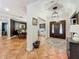 Bright entryway featuring ceramic tile floors and providing views into the dining room and front door at 213 Sheffield E Cir, Palm Harbor, FL 34683