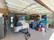 Spacious garage with trailer parking, storage, and epoxy flooring at 213 Sheffield E Cir, Palm Harbor, FL 34683