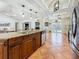 Well-appointed kitchen featuring granite countertops, modern appliances, and easy access to living spaces at 213 Sheffield E Cir, Palm Harbor, FL 34683