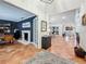 Large living room with views to the dining and bonus rooms. Tile flooring and great natural light at 213 Sheffield E Cir, Palm Harbor, FL 34683