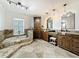 Luxurious main bathroom with dual sinks, granite counters, soaking tub, and a separate shower at 213 Sheffield E Cir, Palm Harbor, FL 34683