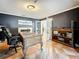 Charming office space with fireplace, ornate desk, and views into the home at 213 Sheffield E Cir, Palm Harbor, FL 34683