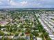 An aerial view showcases the property nestled among lush greenery and ponds at 232 Emerald Ln, Largo, FL 33771