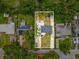 Aerial view of property showing boundaries, yard, and surrounding greenery at 232 Emerald Ln, Largo, FL 33771