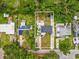 Aerial view of property showing boundaries, yard, and surrounding greenery at 232 Emerald Ln, Largo, FL 33771