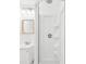 Bright bathroom featuring a vanity and shower with white walls at 232 Emerald Ln, Largo, FL 33771