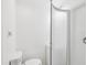 Bright bathroom featuring a toilet and shower with white walls at 232 Emerald Ln, Largo, FL 33771