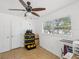 This bedroom has ceiling fan, and natural lighting at 232 Emerald Ln, Largo, FL 33771