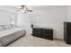 This well lit bedroom has neutral colors, and carpeted floors at 232 Emerald Ln, Largo, FL 33771