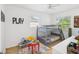 This bedroom has a bunk bed, with ceiling fan and natural lighting at 232 Emerald Ln, Largo, FL 33771