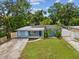 Charming home with a well-manicured lawn, driveway, and stylish curb appeal at 232 Emerald Ln, Largo, FL 33771