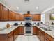 Well-equipped kitchen featuring stainless steel appliances and granite countertops at 232 Emerald Ln, Largo, FL 33771