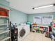 Well-equipped laundry room with washer, dryer, and ample storage space, making laundry chores a breeze at 232 Emerald Ln, Largo, FL 33771