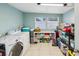 Well-equipped laundry room with washer, dryer, and ample storage space, making laundry chores a breeze at 232 Emerald Ln, Largo, FL 33771
