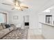 Bright living room area with modern decor, comfortable seating, and seamless transition to the kitchen at 232 Emerald Ln, Largo, FL 33771