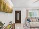 Comfortable living room featuring a couch, TV, and stylish decor at 232 Emerald Ln, Largo, FL 33771
