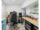 This office has an adjustable desk and chair, and lots of storage with a work bench at 232 Emerald Ln, Largo, FL 33771