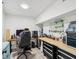 This office has an adjustable desk and chair, and lots of storage with a work bench at 232 Emerald Ln, Largo, FL 33771