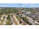 An aerial view of neighborhood with a commercial district and view of the bay and bridges, shown with red map pin at 2366 Shelley St # 7, Clearwater, FL 33765