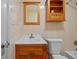 This bathroom features a shower and wood cabinetry at 2366 Shelley St # 7, Clearwater, FL 33765