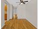 Dining room with wood floors and view of the kitchen with wood cabinets at 2366 Shelley St # 7, Clearwater, FL 33765