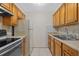 Galley kitchen with a double basin sink and matching appliances at 2366 Shelley St # 7, Clearwater, FL 33765