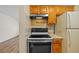 This kitchen features matching wooden cabinetry and appliances at 2366 Shelley St # 7, Clearwater, FL 33765