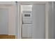 This laundry closet features a stacked washer and dryer hidden behind sliding doors at 2366 Shelley St # 7, Clearwater, FL 33765