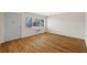 Open-concept living room with wood flooring and ample natural light from the window at 2366 Shelley St # 7, Clearwater, FL 33765
