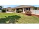 Landscaped backyard with patio and lush lawn, perfect for outdoor living and entertaining at 2515 Centennial Falcon Dr, Valrico, FL 33596
