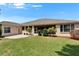 Backyard with patio and lush lawn, perfect for outdoor living and entertaining at 2515 Centennial Falcon Dr, Valrico, FL 33596
