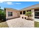 Backyard patio area featuring well-maintained garden and access to the screened-in lanai at 2515 Centennial Falcon Dr, Valrico, FL 33596