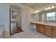Bright bathroom with a vanity and a view into another room at 2515 Centennial Falcon Dr, Valrico, FL 33596
