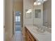 Bathroom with a large vanity, decorative lighting, and views to the bedroom at 2515 Centennial Falcon Dr, Valrico, FL 33596
