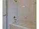 Bathroom featuring tiled shower and tub with neutral walls and fixtures at 2515 Centennial Falcon Dr, Valrico, FL 33596