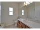 Bathroom featuring a large mirror, vanity, toilet, and tiled floor at 2515 Centennial Falcon Dr, Valrico, FL 33596