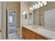 Bathroom featuring a large vanity, decorative lighting, and tile floors at 2515 Centennial Falcon Dr, Valrico, FL 33596