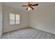 Bedroom with neutral carpet, a ceiling fan, and a shuttered window at 2515 Centennial Falcon Dr, Valrico, FL 33596