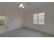 Bedroom with gray carpet, white walls, shuttered window, and ceiling fan at 2515 Centennial Falcon Dr, Valrico, FL 33596