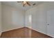Bedroom with hardwood floors, a ceiling fan, and an attached bathroom at 2515 Centennial Falcon Dr, Valrico, FL 33596